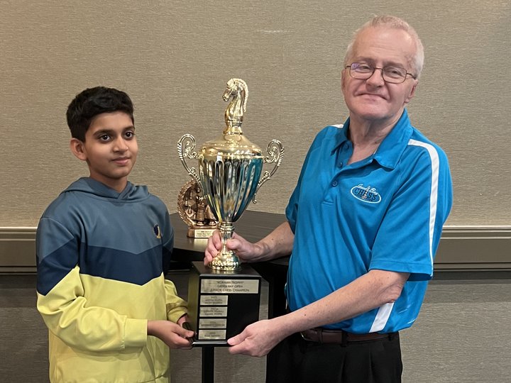 Shravan Sabarish receiving the 49th Green Bay Open Junior Champion trophy